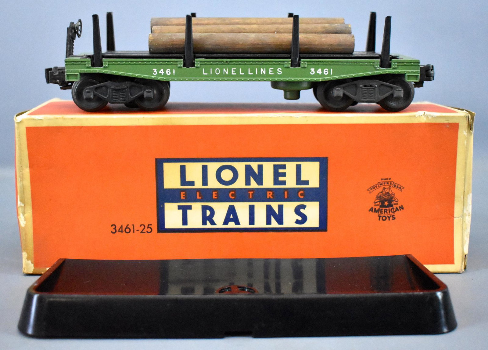 Lionel postwar O 3461-25 automatic lumber car in: Lionel postwar O 3461-25 automatic lumber car in original box, C7-8 in a very good original box that has some bug damage around the outer edges as seen in the photos.