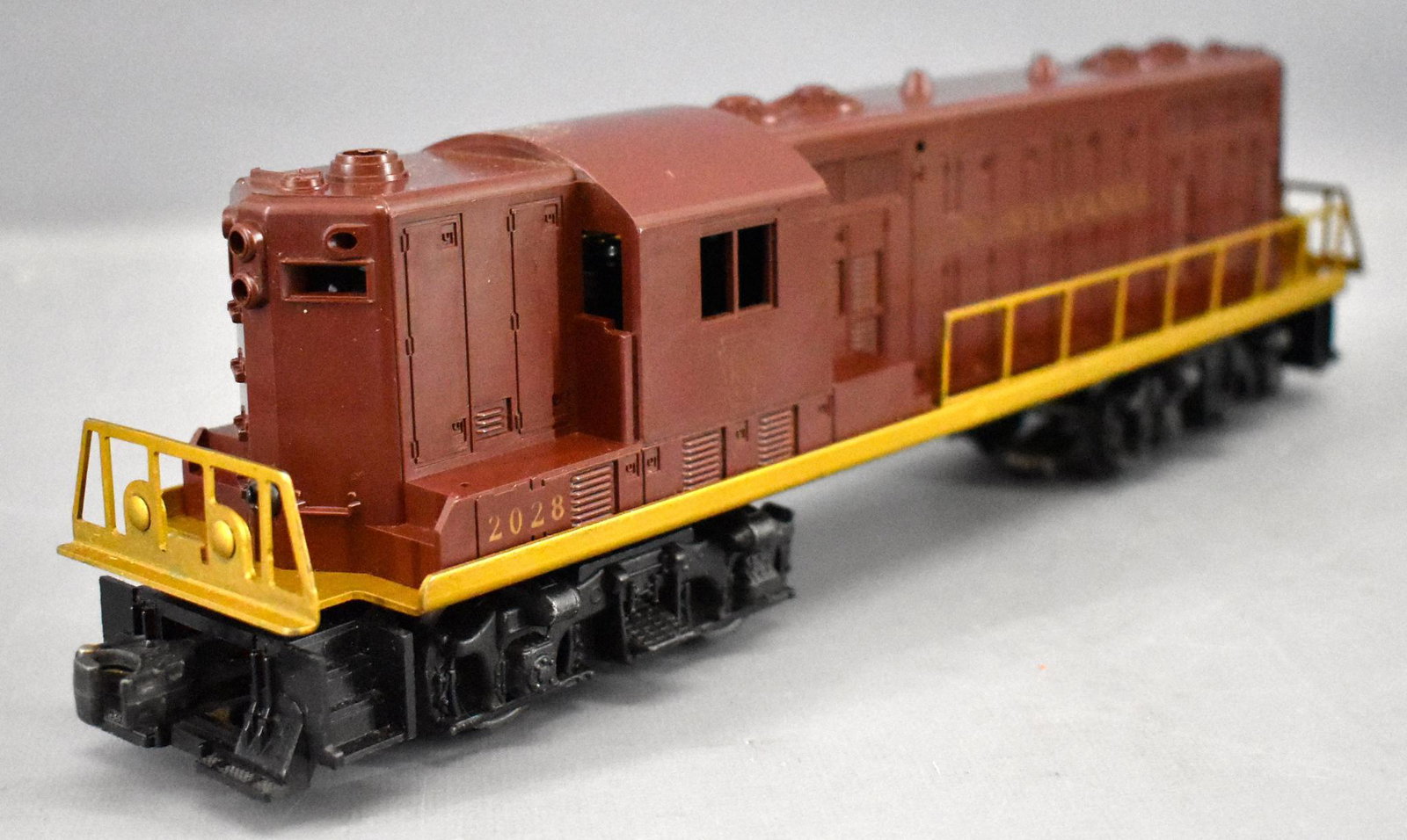 Lionel postwar O 2028 Pennsylvania GP-7 diesel: Lionel postwar O 2028 Pennsylvania GP-7 diesel locomotive, lettering is faint on one side and a little more solid on the opposite side but has been touched up in the center of the side with more solid