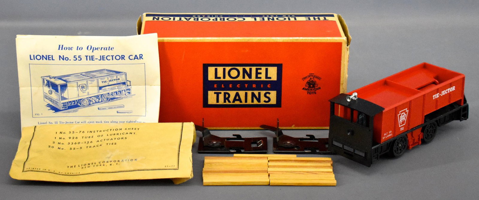 Lionel postwar O 55 tie jector car in original box: Lionel postwar O 55 tie jector car in original box, shows very light run time and is the more common variation with no slot, C8 with a complete parts packet that has a tape repair and a very good orig