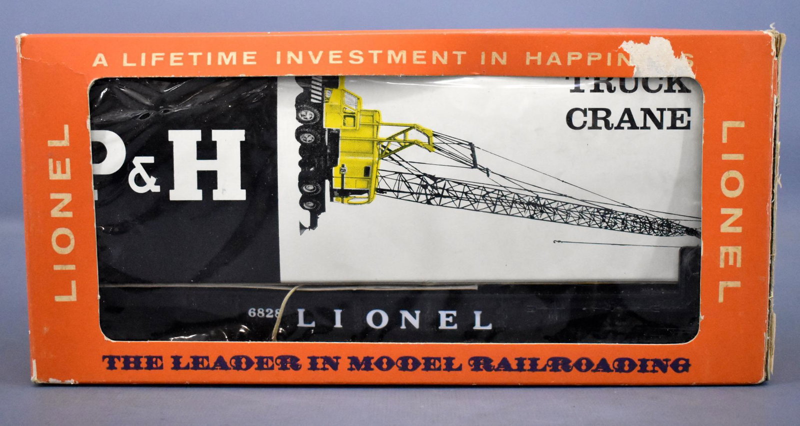 Mint unrun Lionel postwar O 6828 Harnischfeger truck: Mint unrun Lionel postwar O 6828 Harnischfeger truck crane flat car in original box. Carne is the dark yellow variation and is C9-10 in a near mint inner box with original instruction booklet. The cel