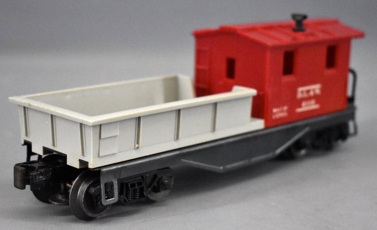 Scarce Lionel postwar O 6119-100 D.L. & W. work caboose: Scarce Lionel postwar O 6119-100 D.L. & W. work caboose with builder plate. Cars shows moderate run time and is very nice and clean. This scarce variation has a Built By Lionel plate on the bottom rea