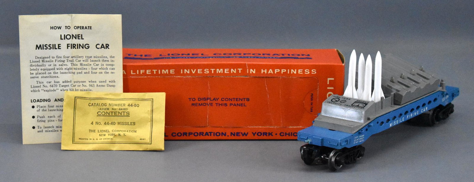 Lionel postwar O 6844 missile firing trail car with: Lionel postwar O 6844 missile firing trail car with black console in original box. Car shows moderate run time and is missing both brake stands but has a black console. Comes with a crisp original ins