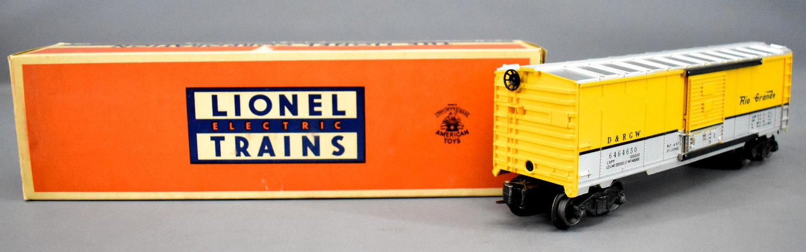 Lionel postwar O 6464-650 Rio Grande box car in: Lionel postwar O 6464-650 Rio Grande box car in original box, car shows moderate run time and is C7 with a type IIb body in a very good original box.