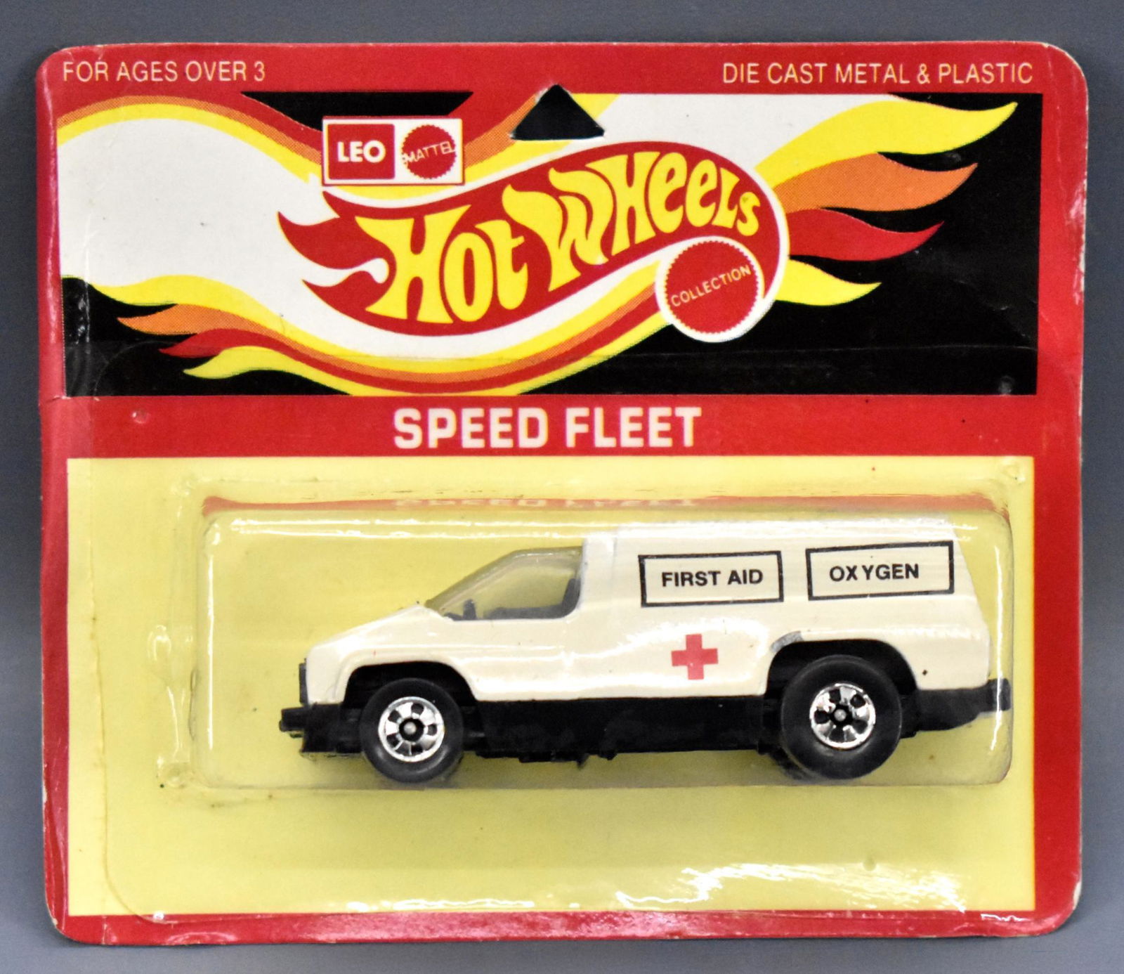 India Leo Hot Wheels Speed Fleet Inside Story first aid: India Leo Hot Wheels Speed Fleet Inside Story first aid ambulance on blister card, card has been punched but the blister is clear yet has a crack along the bottom.