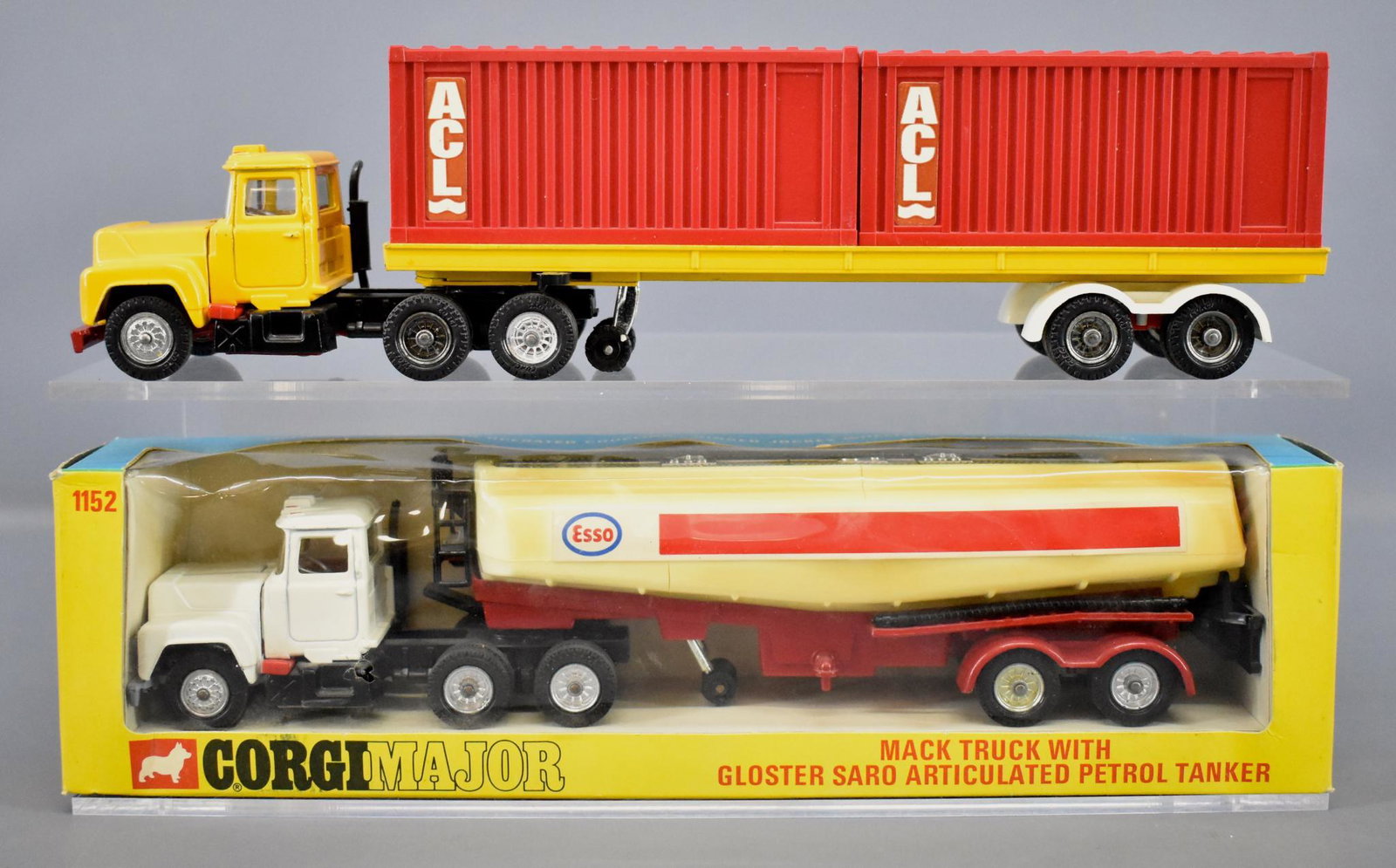 Corgi 1106 and 1152 Mack semi tractors with trailers: Corgi 1106 and 1152 Mack semi tractors with one ACL trailer and one Esso tanker trailer and one original box. Both are excellent to near mint but the Esso trailer is yellowed. The 1152 original box is