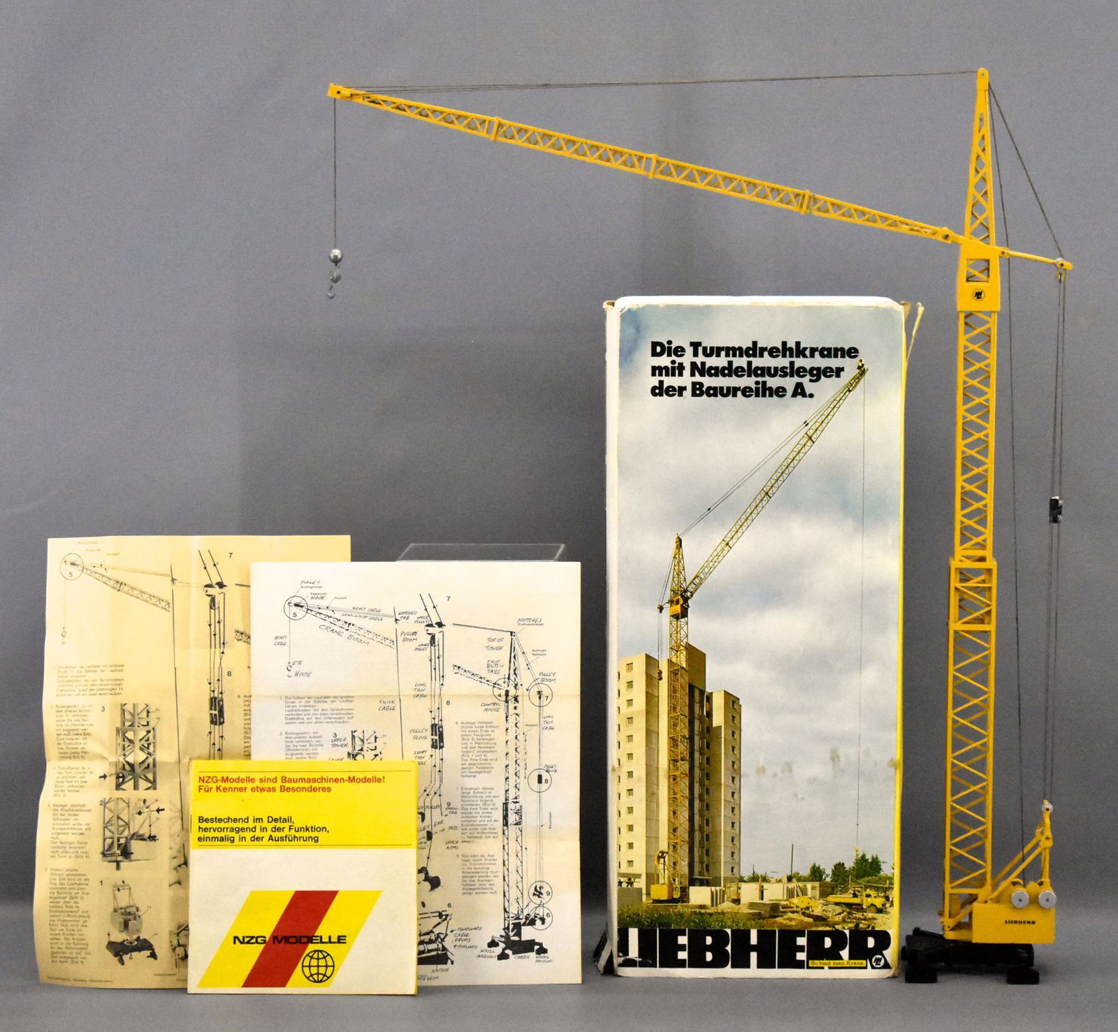 Gescha Liebherr-Werke 7950 tower crane with original: Gescha Liebherr-Werke 7950 tower crane with original box, it is assembled and stands 23 1/2 inches high. The original box is in fair to good condition and comes with original instruction sheets plus a