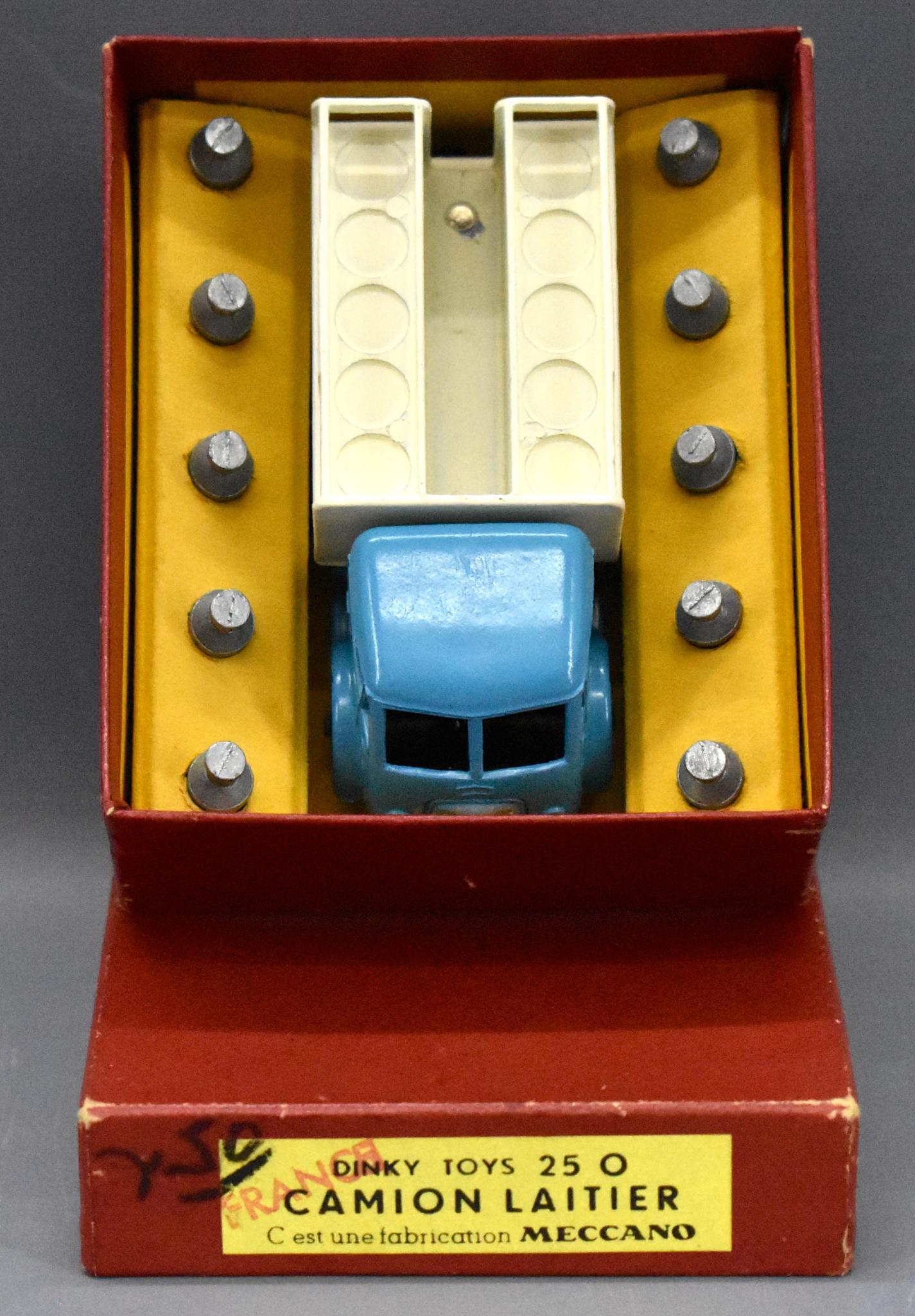 Vintage French Dinky 25 O Camion Laitier milk truck in: Vintage French Dinky 25 O Camion Laitier milk truck in original box, near mint condition with a tiny chip in the bed next to the rivet, otherwise superb with all milk cans and an excellent plus origin