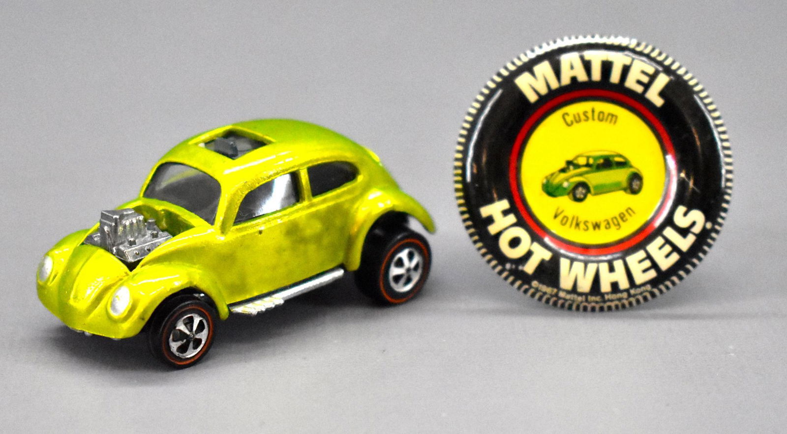 Redline Hot Wheels antifreeze US Custom Volkswagen: Redline Hot Wheels antifreeze US Custom Volkswagen with original metal button. Car is very nice and clean with some toning on one side and a paint bubble on the other side and a shiny base. The origin