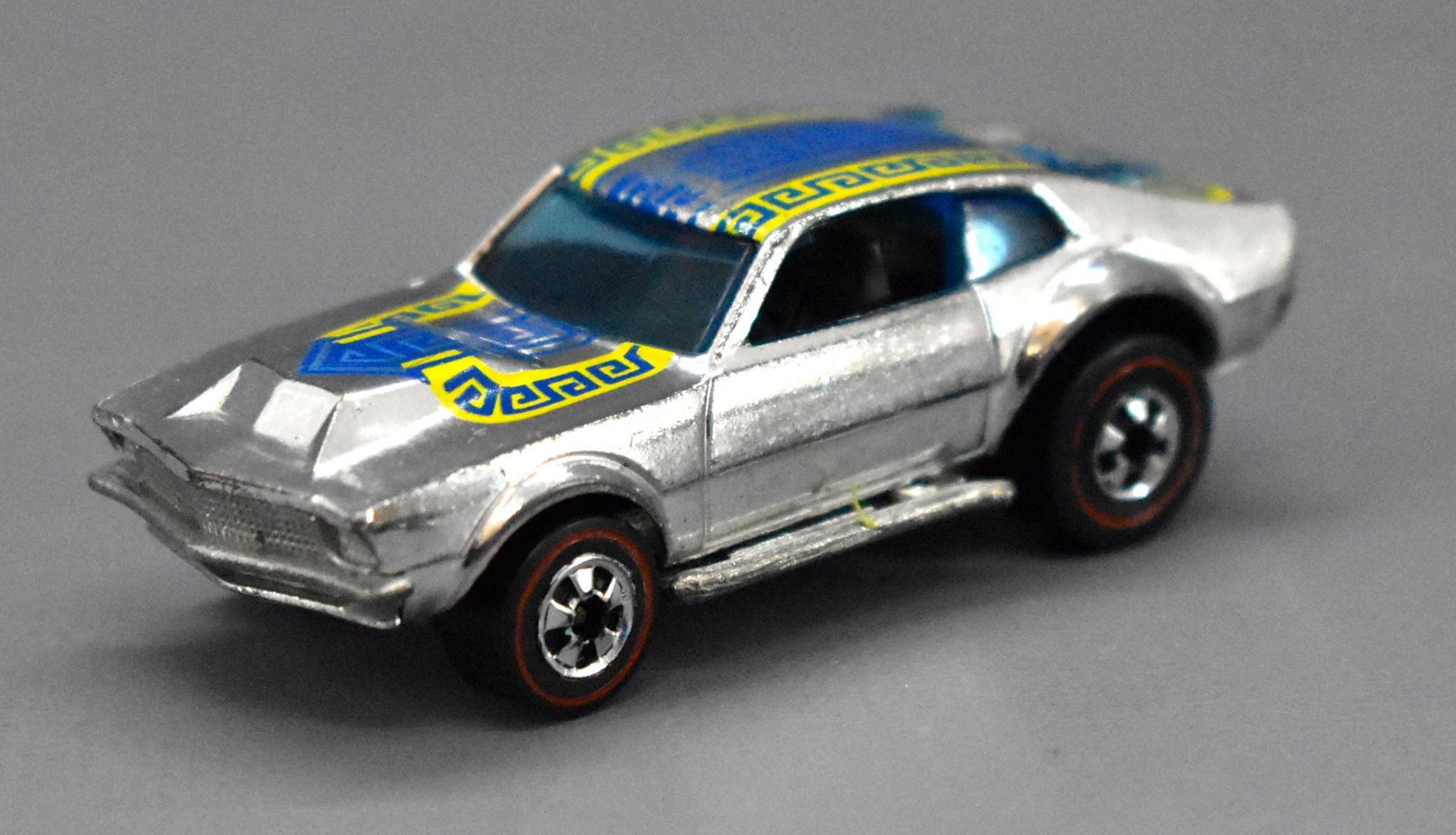 Redline Hot Wheels chrome HK Mighty Maverick: Redline Hot Wheels chrome HK Mighty Maverick, clean with tampo rubs just behind the windshield, very shiny ow with a nice base as seen in the photos.
