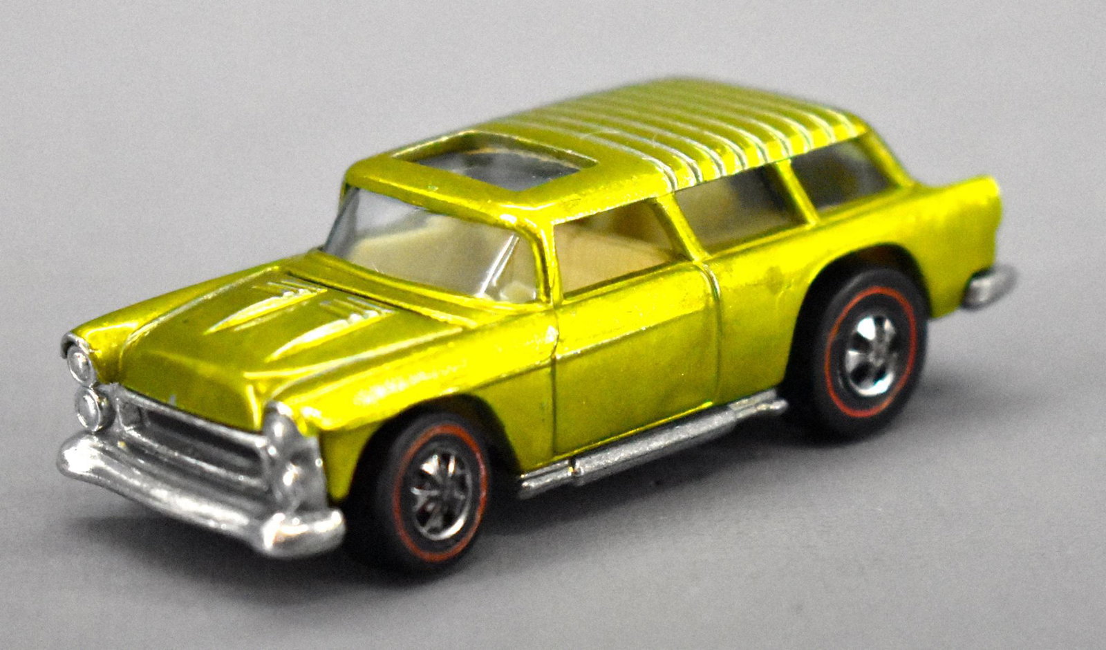 Redline Hot Wheels lime US Classic Nomad: Redline Hot Wheels lime US Classic Nomad, very nice and clean with little to no wear but does have some minor toning and chrome loss from the rims and has a shiny base as seen in the photos.