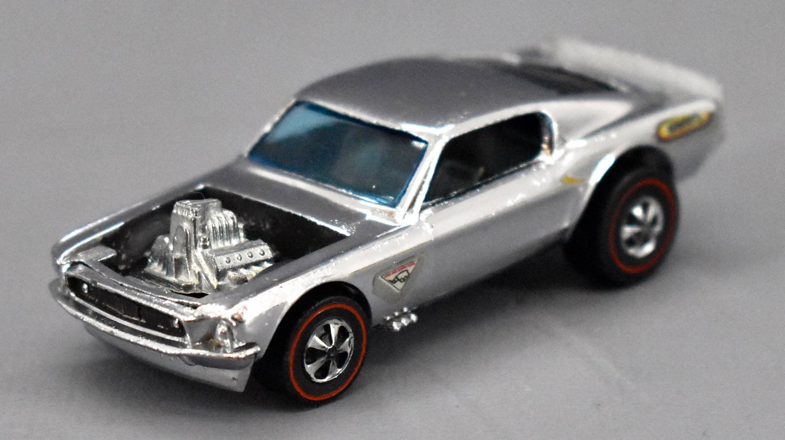 Redline Hot Wheels chrome HK Boss Hoss: Redline Hot Wheels chrome HK Boss Hoss, super nice and clean with a super shiny base but missing the roundels yet has Wynn's decals on both quarters as seen in the photos.