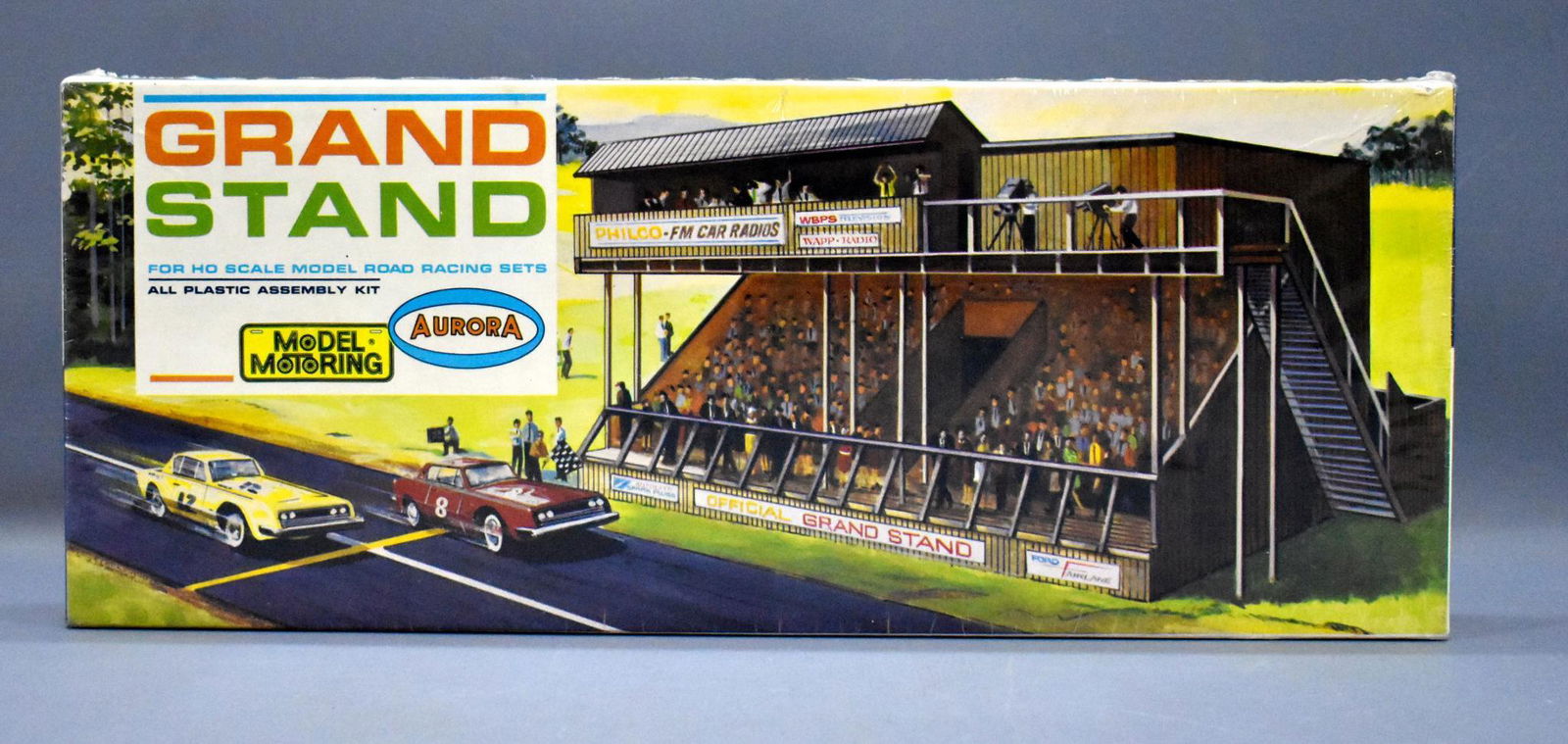 Factory sealed Aurora Model Motoring HO slot car grand: Factory sealed Aurora Model Motoring HO slot car grand stand kit, 1452-149, high grade box with factory sealed cellophane.