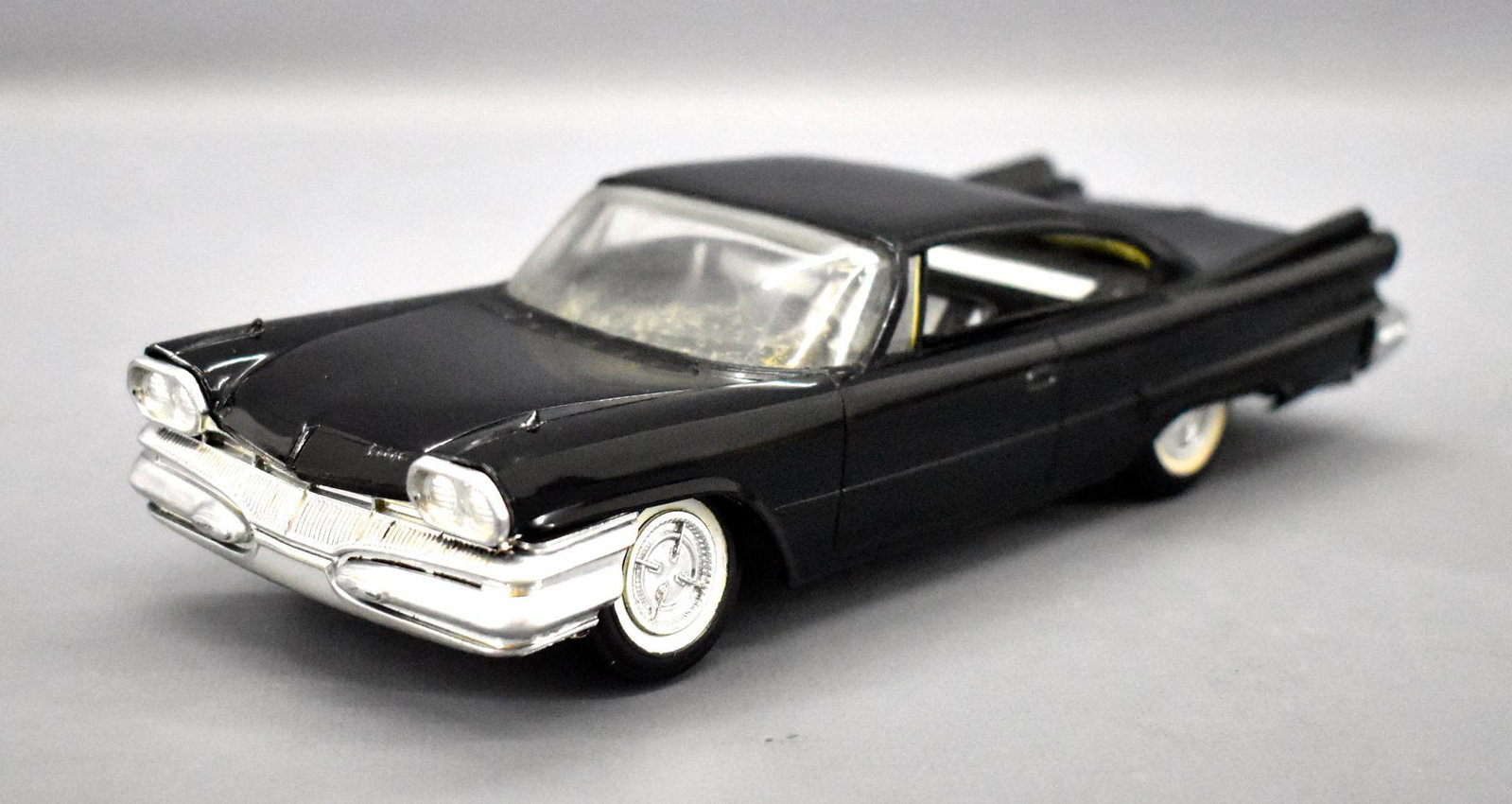 Rare solid black 1960 Jo-Han Dodge torsion dealer promo: Rare solid black 1960 Jo-Han Dodge torsion dealer promo car. Car looks great but has some warpage and is slightly twisted to where one wheel sits 1/16" off of the flat surface. It has crazing in the w
