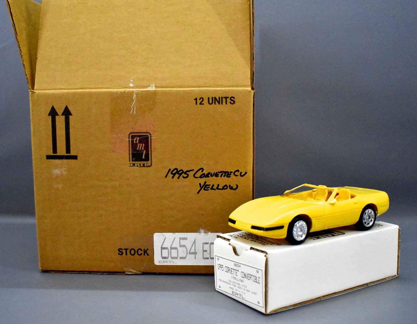 Full case of AMT Ertl 1995 Corvette convertible promo: Full case of AMT Ertl 1995 Corvette convertible promo cars in yellow, all mint with near mint original boxes and a nice original shipping carton.