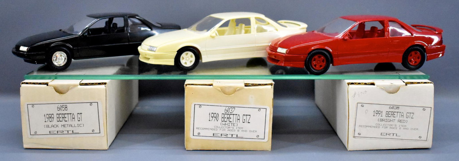 AMT Ertl 1989-1991 Chevy Beretta GT GTZ promo cars in: AMT Ertl 1989-1991 Chevy Beretta GT GTZ promo cars in original boxes, black metallic, white and bright red respectively, all near mint to mint in excellent original boxes.
