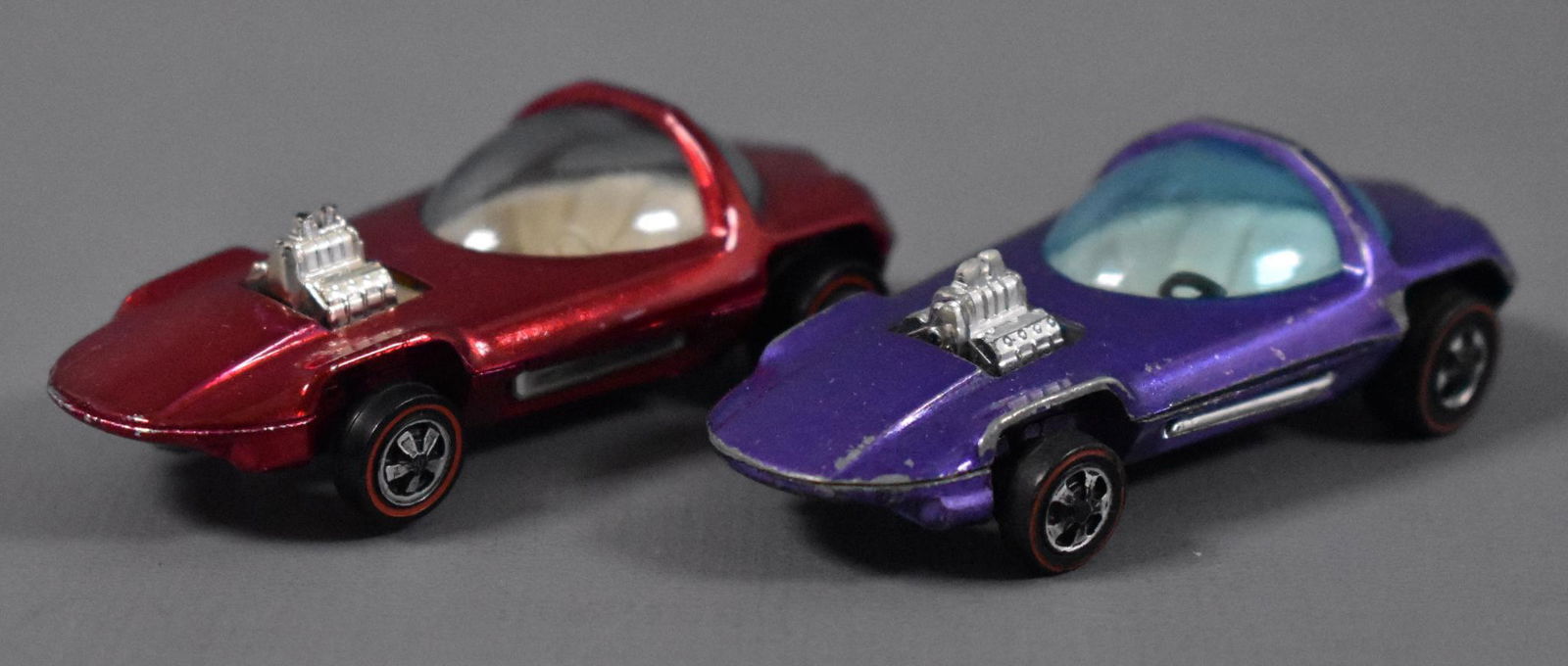 Two Original Redline Hot Wheels Beatnik Bandit: Two Original Redline Hot Wheels Beatnik Bandit, one red and one purple, both clean with play wear as seen in the photos.