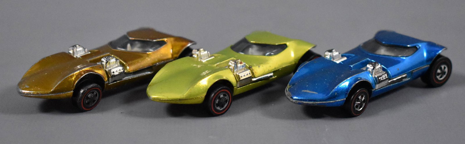 Three Original Redline Hot Wheels Twinmills: Three Original Redline Hot Wheels Twinmill to include blue, antifreeze and gold, all three are clean but have play wear as seen in the photos.