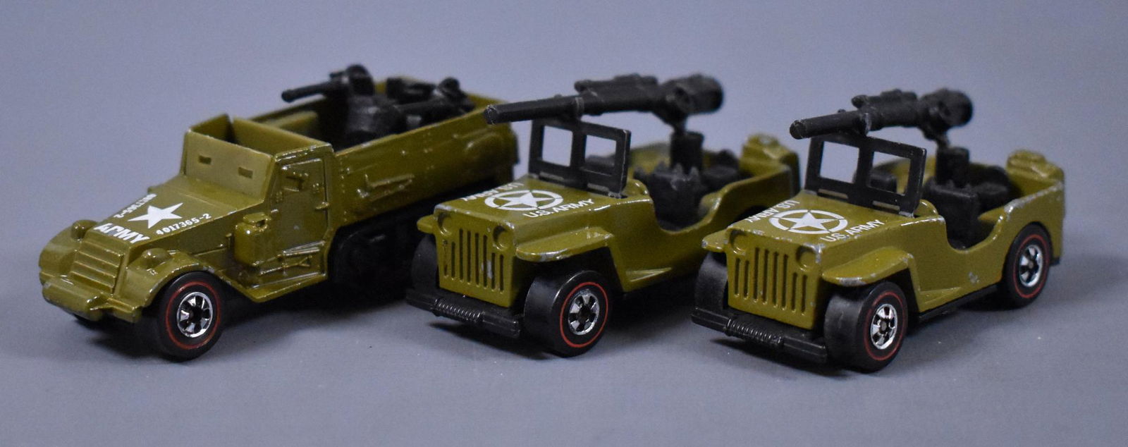 Three Original Redline Hot Wheels Army vehicles: Three Original Redline Hot Wheels Army vehicles to include two Gun Slinger and Gun Bucket, all three are clean but have some play wear as seen in the photos.