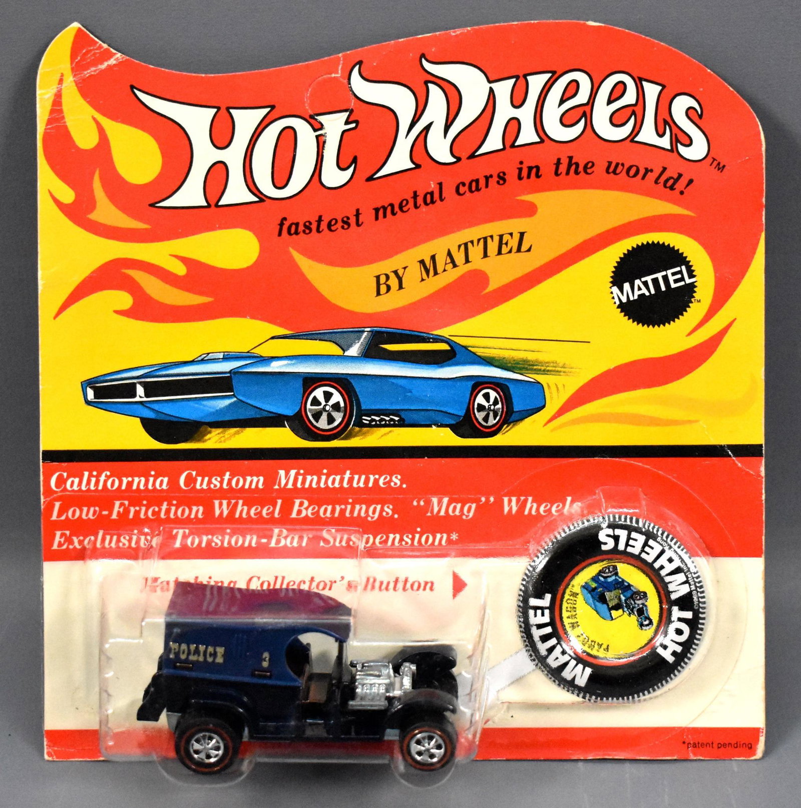 Original Redline Hot Wheels Paddy Wagon MOC: Original Redline Hot Wheels Paddy Wagon MOC, near mint on a factory sealed blister card with button. The card is unpunched with wear at the top left and a slightly squashed but clear blister.