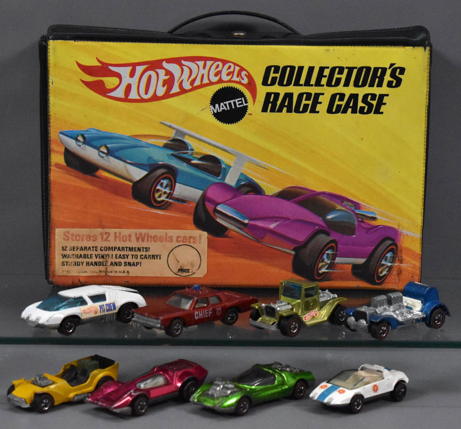 Original Redline Hot Wheels 12 car collector case with: Original Redline Hot Wheels 12 car collector case with eight cars, all have play wear as seen in the photos.