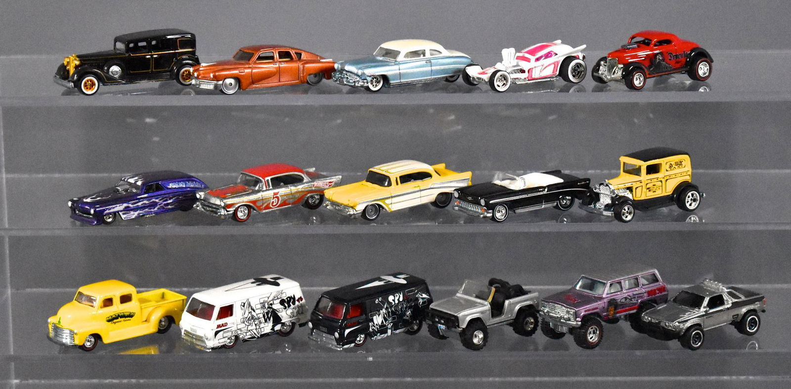 Sixteen loose Hot Wheels Real Riders die cast cars