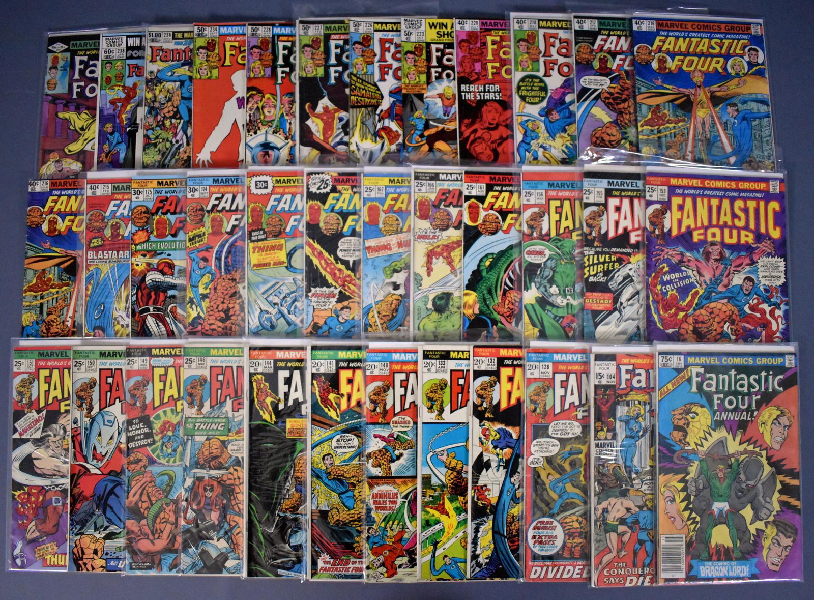 Thirty-six Marvel Fantastic Four comic books 104-241: Thirty-six Marvel Fantastic Four comic books to include 104, 128, 132, 133, 140, 141, 144, 146, 149-151, 153, 155, 156, 161, 166, 167, 169, 170, 174, 175, 215-218 (two #216), 218, 220, 223, 226-228, 2