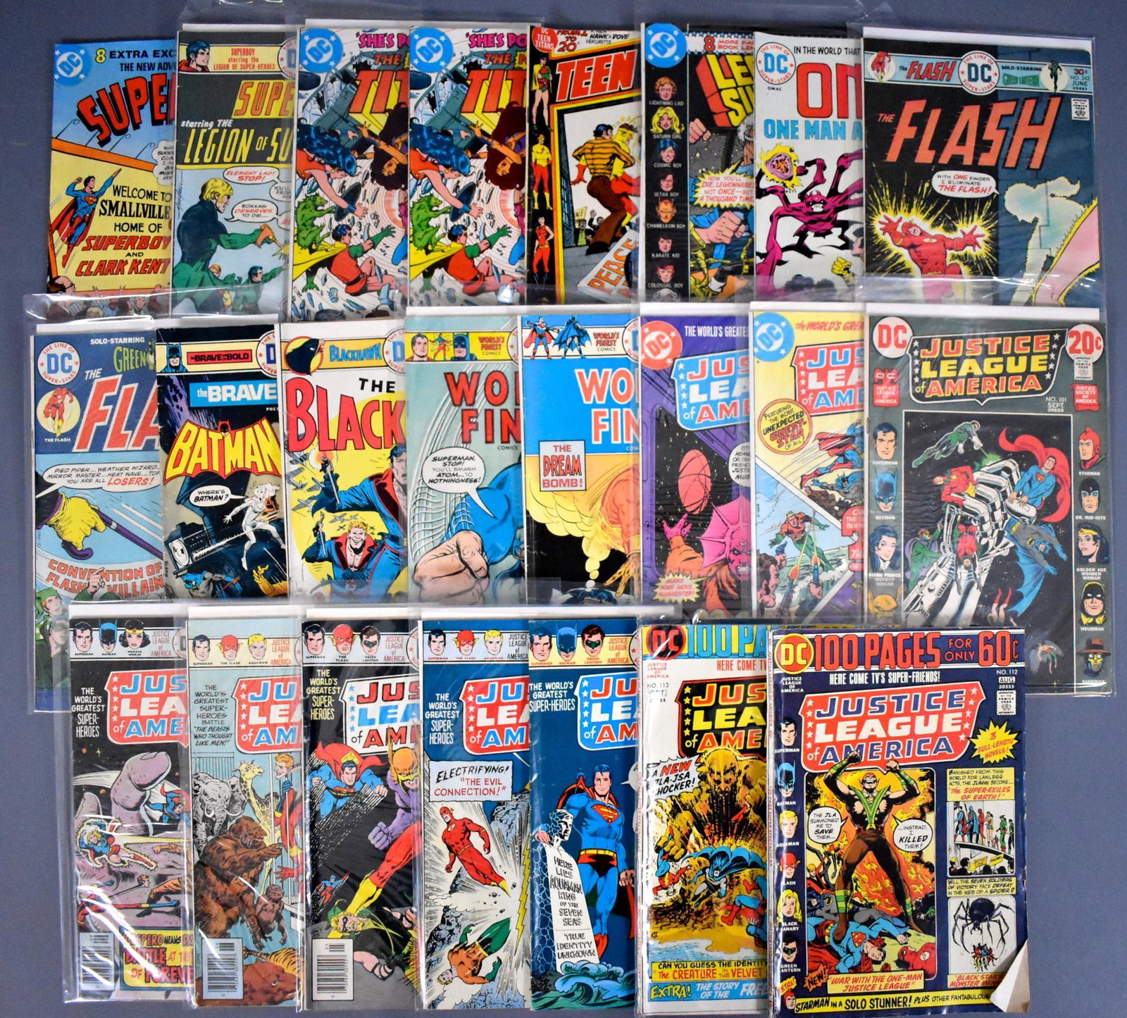 Twenty-three 1970's DC mixed superhero comic books: Twenty-three DC mixed superhero comic books to include JLA Justice League of America, Teen Titans, Superboy, Legion of Superheroes, OMAC, Worlds Finest, Blackhawk and Batman, all in good to very good 