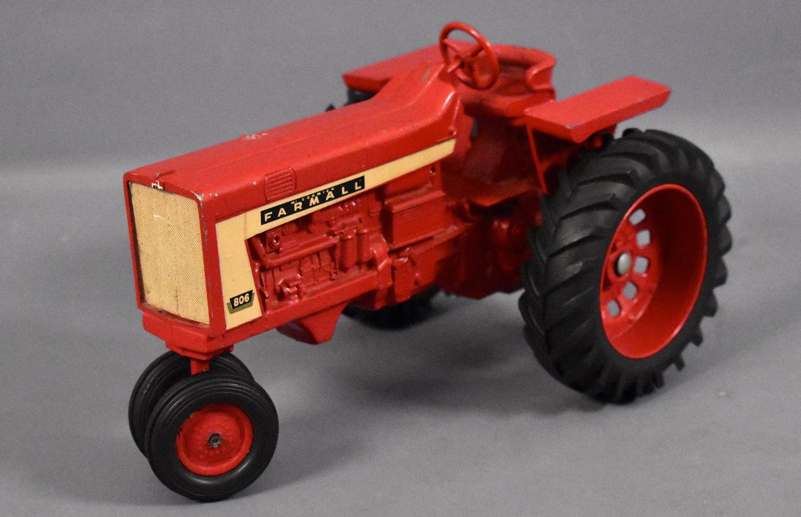 Ertl International Farmall 806 toy farm tractor square: Ertl International Farmall 806 toy farm tractor square fender, missing the grille inserts and stack but otherwise very good condition as seen in the photos.