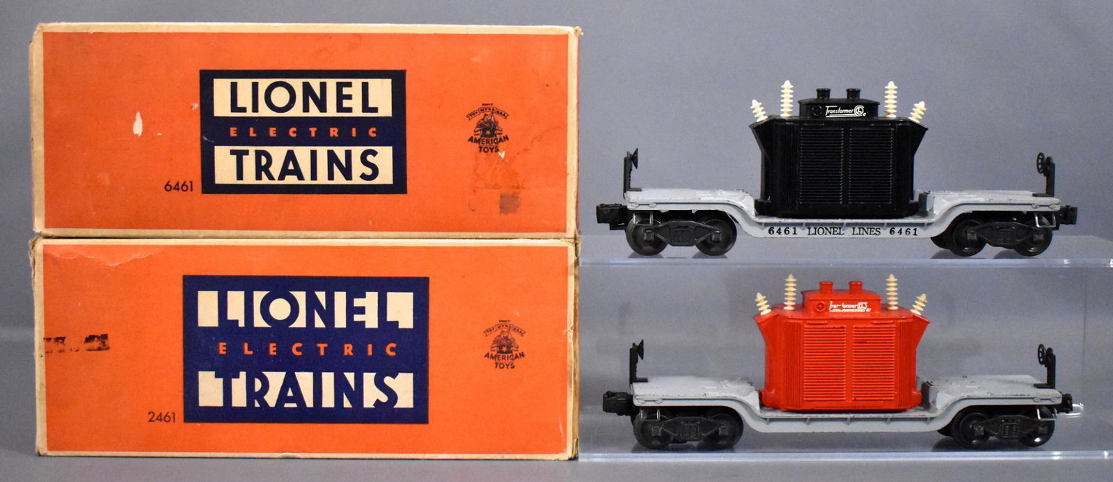 Rare Lionel postwar O 2461 transformer car 6461: Lionel postwar O 2461 red and 6461 black transformer cars in original boxes, both are C6-7 with fair to good original boxes and original inserts. The 2461 is a rare variation with no lettering on the 
