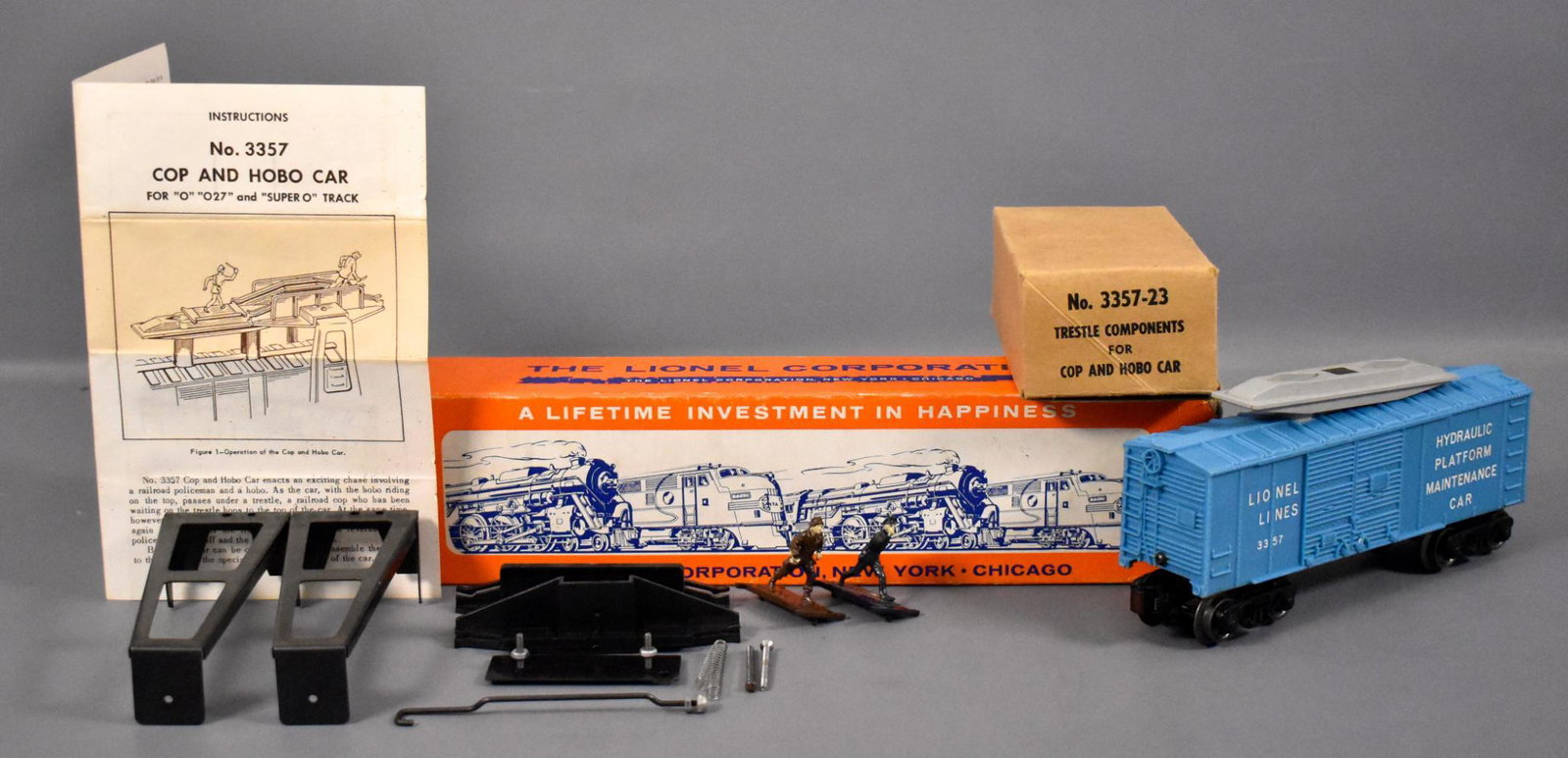 Lionel postwar O 3357 AQUA cop and hobo car set in: Lionel postwar O 3357 AQUA cop and hobo car set in original box, car shows very light run time and is C8-9 with a complete 3357-23 component set in a repaired inner box, crisp original instruction she