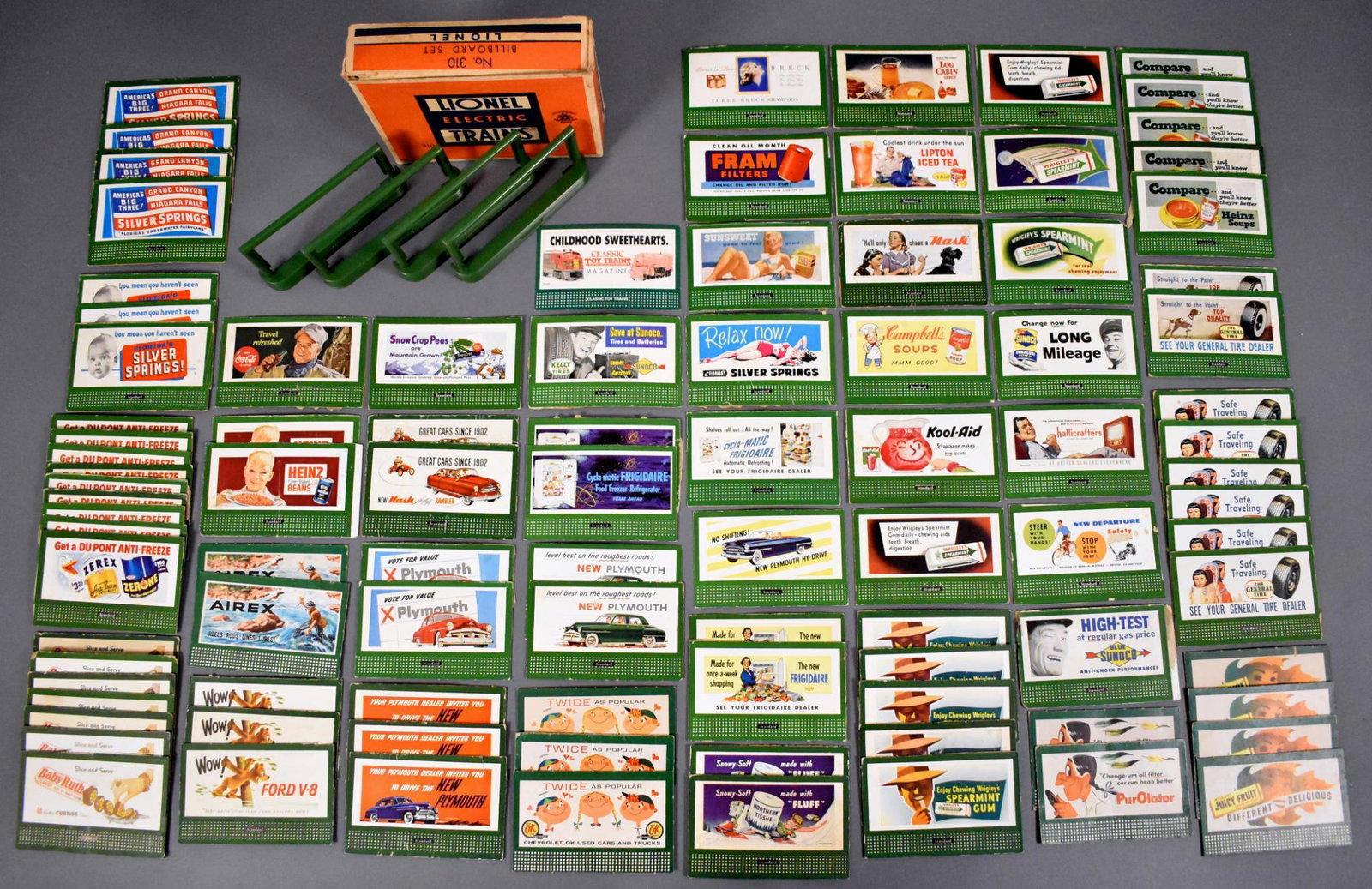 Group of 95 Lionel postwar O billboards and a 310: Group of 95 Lionel postwar O billboards and a 310 billboard set in original box. There are 95 individual billboards with 44 different billboards plus a complete 310 billboard set in an excellent origi