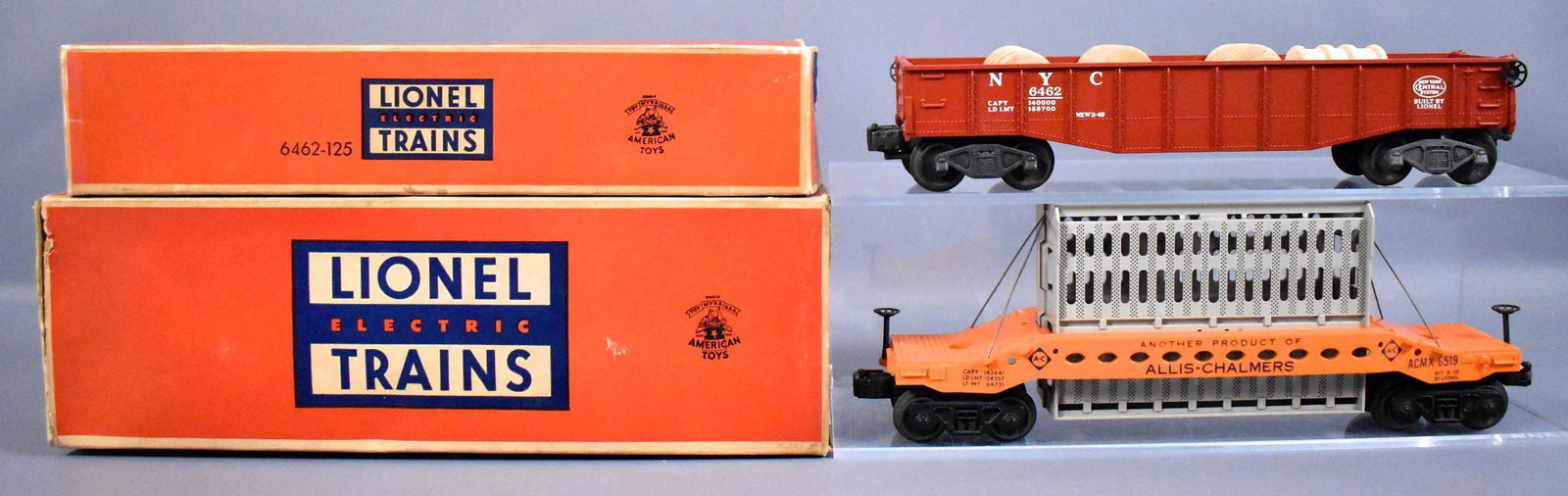 Lionel postwar O 6462 6519 freight cars in original: Lionel postwar O 6462 red painted gondola and 6519 Allis Chalmers car in original boxes, C6-7 with good to very good original boxes.