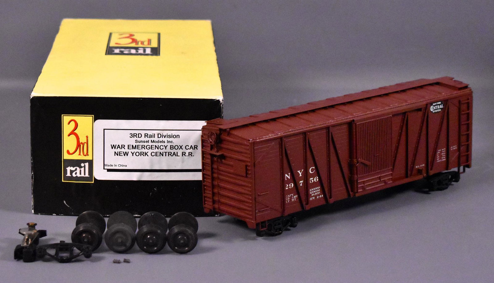 Sunset 3rd rail O scale 3 rail brass New York Central: Sunset 3rd rail O scale 3 rail brass New York Central war emergency box car in original box. The die cast trucks have fallen apart but the body is still C9+ in a good original box with original fo
