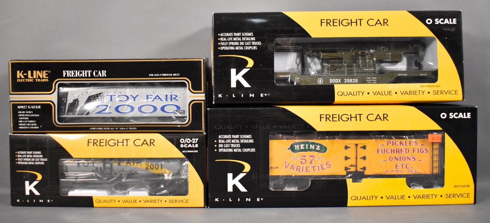 Four K-Line O gauge freight cars in original boxes: Four K-Line O gauge freight cars in original boxes to include 2000 Toy Fair vat car, 2001 Toy fair three dome tank car, depressed center flat car with cannon and Heinz pickles woodside reefer, C8 in e