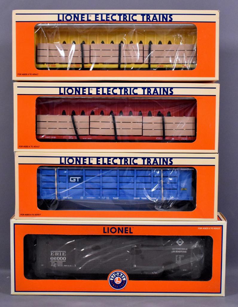 Four Lionel modern era O freight cars in original boxes: Four Lionel modern era O freight cars in original boxes to include 16380 Union Pacific and 16381 CSXT center I-beam flat cars, 16242 Grand Trunk auto carrier with screens and 17284 Erie double-door bo