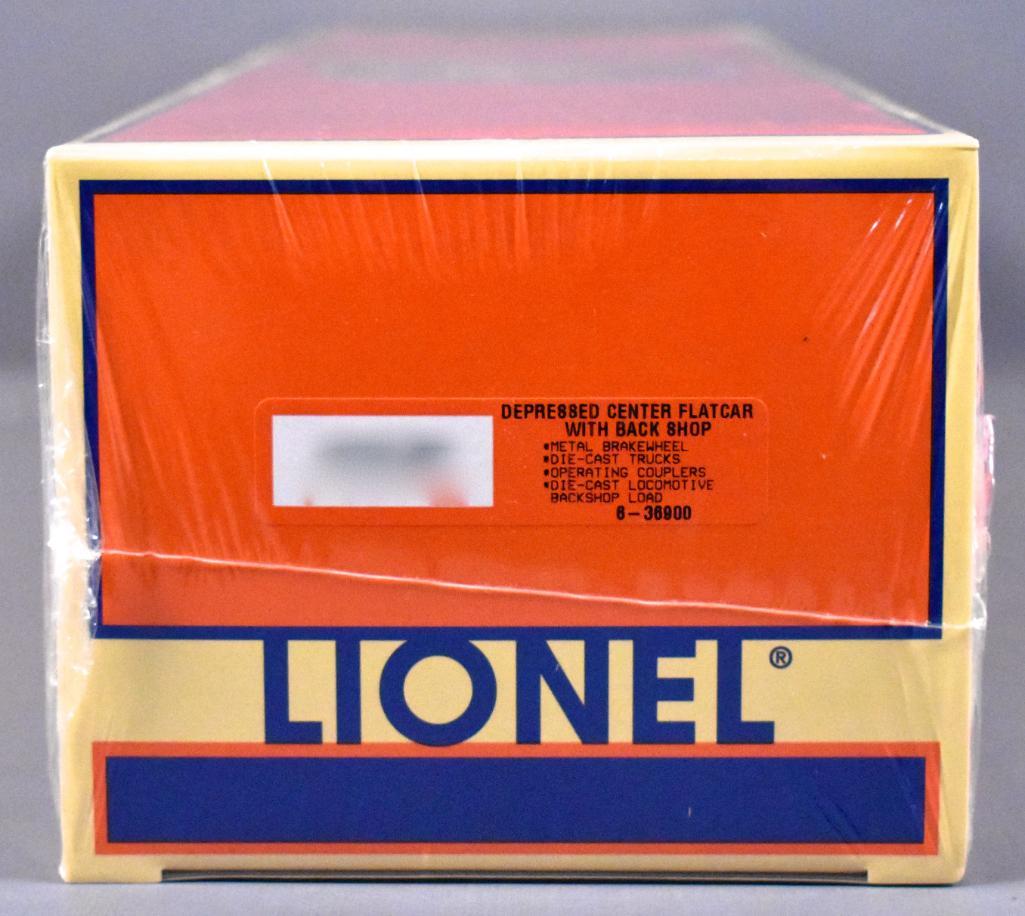 Factory sealed Lionel modern era O 36900 depressed: Factory sealed Lionel modern era O 36900 depressed center flat car w/ back shop load, C10 in master carton that it will be shipped in.