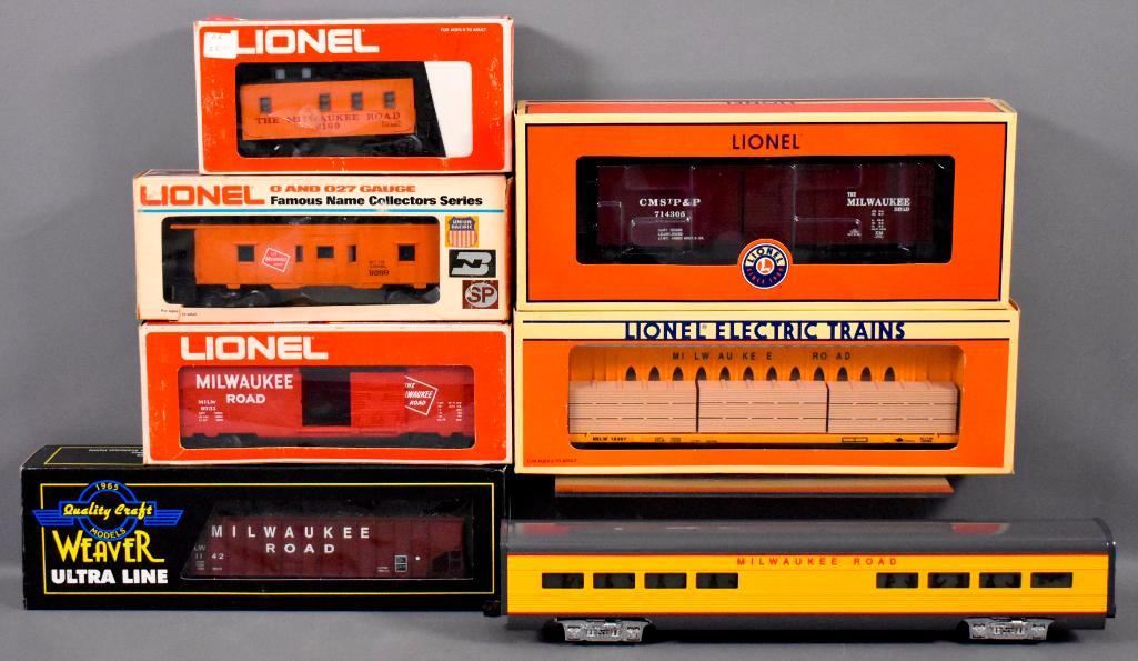 Group of seven Lionel Weaver and other O gauge: Group of seven Lionel Weaver and other O gauge Milwaukee Road trains with original boxes to include Weaver 3-bay ribbed coal car, unmarked extruded aluminum diner car and Lionel 9731 box car, 9169 ill