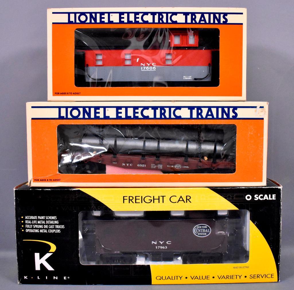 Three K-Line and Lionel modern era O New York Central: Three K-Line and Lionel modern era O New York Central freight cars in original boxes to include Lionel 6521 standard O flat car with stakes, 17606 standard O caboose with illuminated interior, flashin