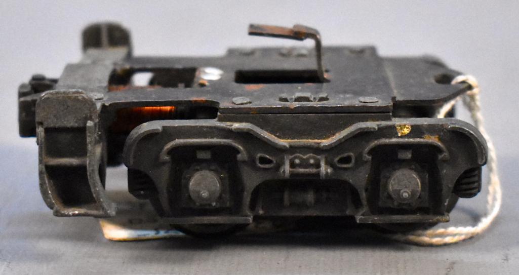 Lionel postwar O 2332-75 end truck: Lionel postwar O 2332-75 end truck, complete and noted as repaired on the dealer tag.
