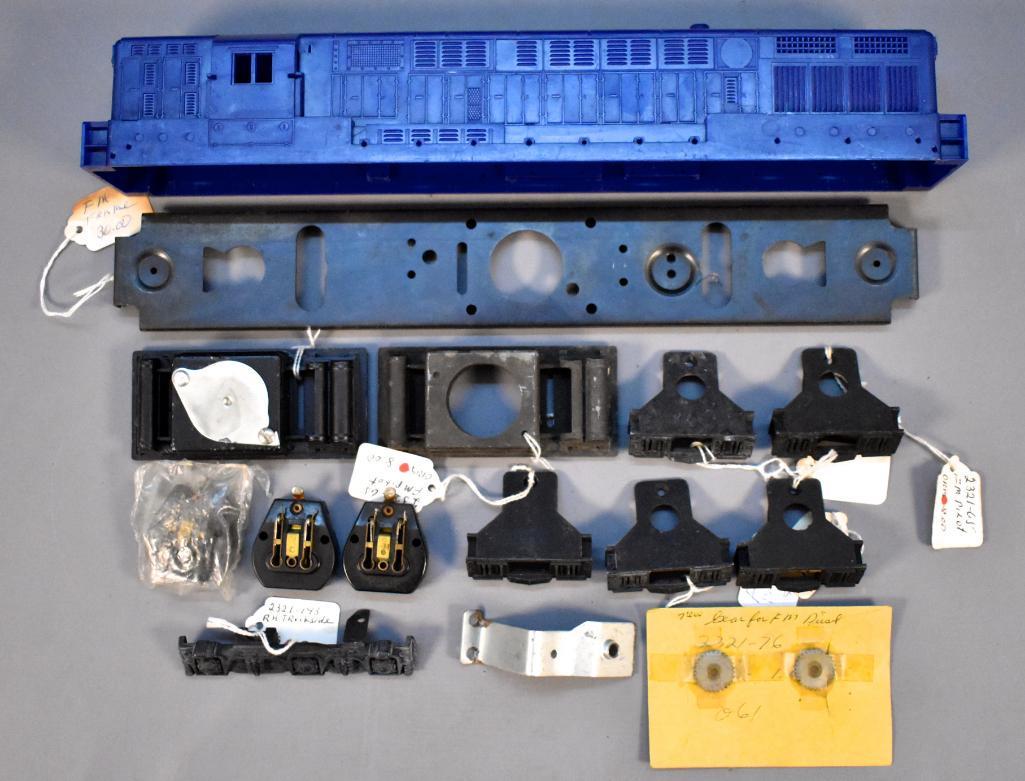 Great group of Lionel postwar O Fairbanks Morse: Great group of Lionel postwar O Fairbanks Morse trainmaster parts and 1966 shell, some used, some new old stock. No screw cracks on the shell.