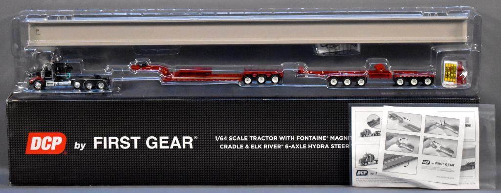 First Gear DCP 1/64 Tractor and Fontaine Low Boy: First Gear DCP 1/64 Kenworth Tractor and Fontaine Magnitude Lowboy Trailer with bunk, cradle and Elk River 6-axle hydra steer with bridge beam section load, mint in original box, red / black.