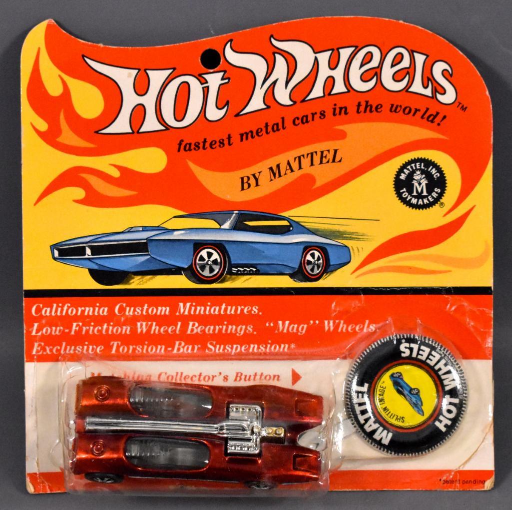 Redline Hot Wheels Red Splitting Image on Blister Card: Redline Hot Wheels Red Splitting Image on Blister Card Car is minty with heavy toning. It has champagne interior and tough early painted headlights. The car is sitting on its side in the blister. The