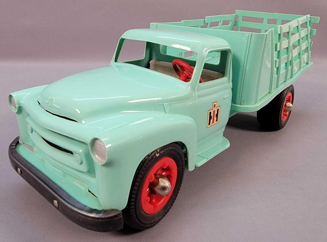 Product Miniature 1950's IH International Harvester: Product Miniature 1950's IH International Harvester dealer promo car stake truck, great looking and clean but is missing three of the four tabs from the rear stakes and they are glued together so 