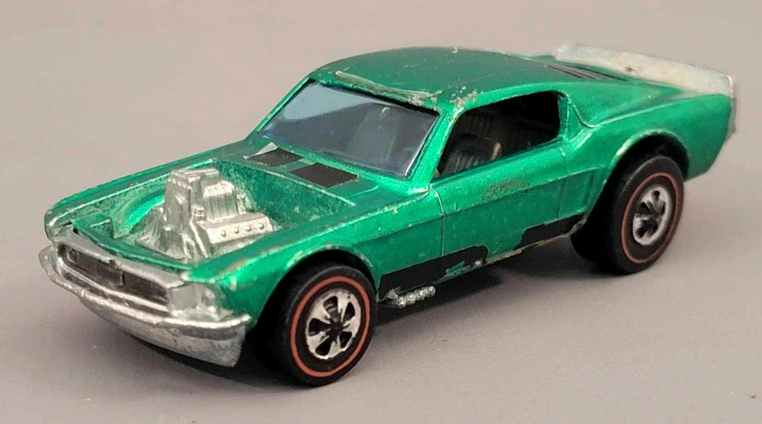 Redline Hot Wheels Spoilers Green Mustang Boss Hoss: Redline Hot Wheels Spoilers Green Mustang Boss Hoss. Car is clean but has some roof and front corner wear, missing its roundels, roof stripes are totally faded. Very nice wheels and clean base. As see