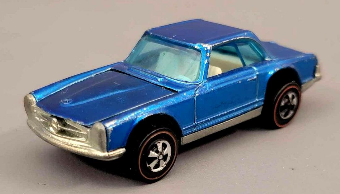 Redline Hot Wheels HK Blue Mercedes Benz 280sl white: Redline Hot Wheels HK Blue Mercedes Benz 280sl with white interior. Paint is bright with the only toning being the hood is slightly darker. Car does have some roof edge wear, and some chipping on the