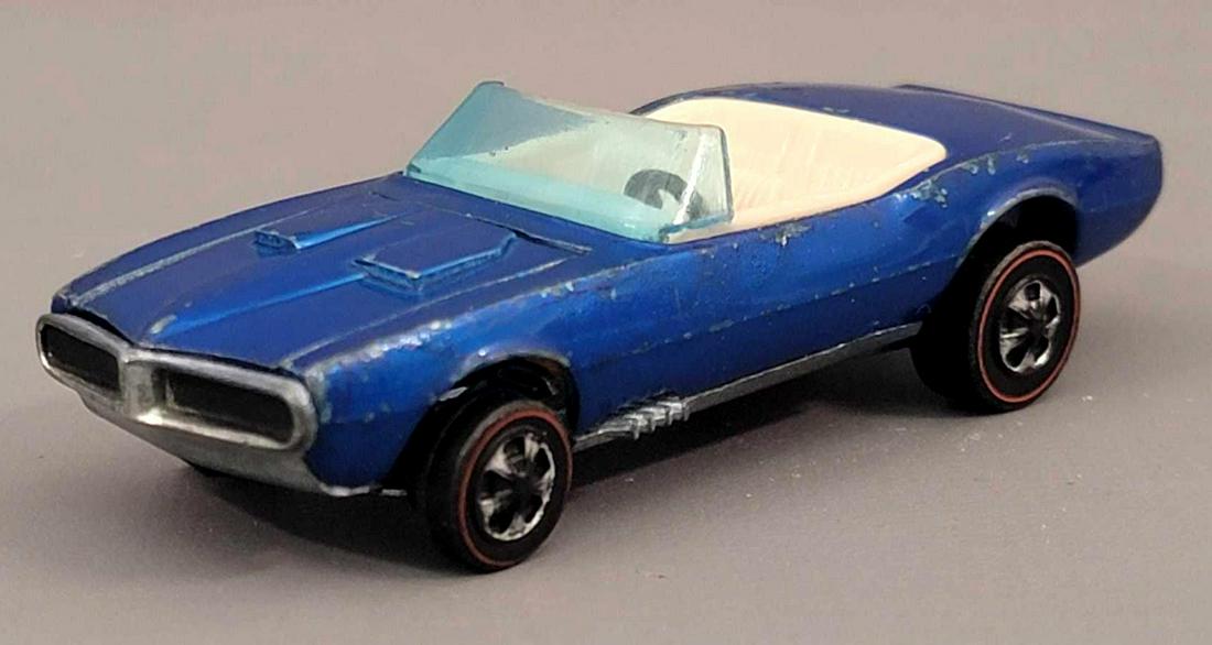 Redline Hot Wheels HK Blue Custom Firebird white: Redline Hot Wheels HK Blue Custom Firebird with white interior. Car is bright and glossy with some high edge wear on fenders, some scattered chips, mainly on trunk , nice grill paint, wheels have sign