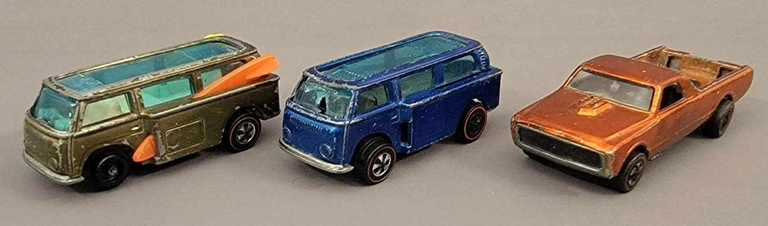 Group of 3 Redline Hot Wheels Fleetside and 2 Beach: Group of 3 Redline Hot Wheels Fleetside and 2 Beach Bombs. All of these cars are filler pieces, olive Beach Bomb has lots of wear, a small crack in the roof glass, has reproduction boards, front caps