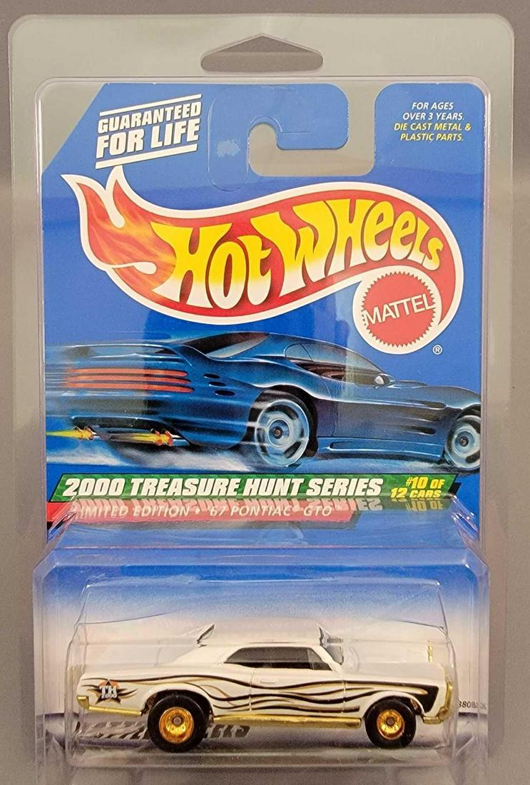 Mattel Hot Wheels 2000 Treasure Hunt '67 Pontiac GTO: Mattel Hot Wheels 2000 Treasure Hunt '67 Pontiac GTO, mint on a near mint card in a protecto pack.