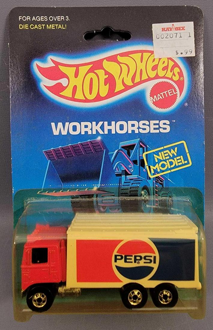 Hot Wheels Blackwall Pepsi Hiway Hauler Blister Pack: Hot Wheels Blackwall Pepsi Hiway Hauler Blister Pack. Truck is minty on a good Workhorses card. Blister is clean, but yellowed with a crack at left upper edge but is firmly attached. As seen in the ph
