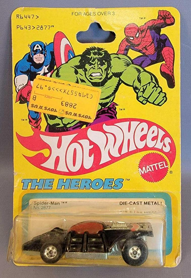 Hot Wheels The Heroes Spider-Man car Blister Pack: Hot Wheels The Heroes Spider-Man car Blister Pack. Car is minty , card is fair with a crease in upper right corner, a large crease across the card above the blister. Blister is yellowed and has blown